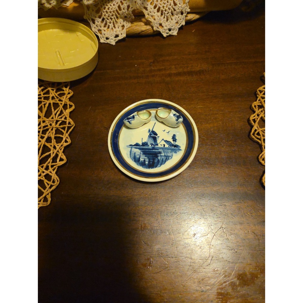 delft blue hand painted holland plate With Little Shoes Attached.